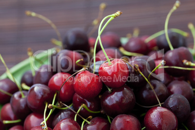 cherry in plate on a bamboo mat