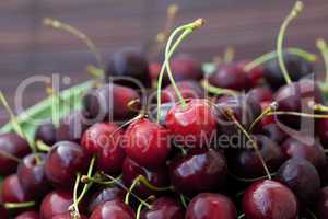 cherry in plate on a bamboo mat