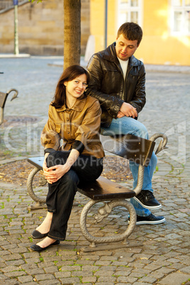 love couple sitting on a bench