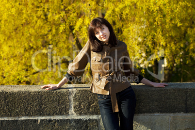 beautiful young woman standing on the bridge