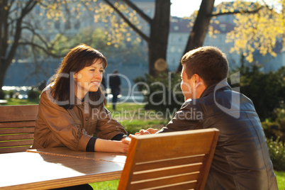 love couple sitting at a table in a cafe