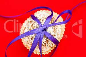 cookies tied with a ribbon on a red background