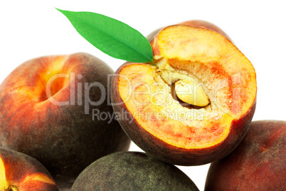 peaches with green leaf isolated on white