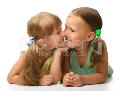 Two little girls are playing