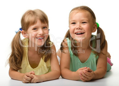 Two little girls are playing