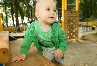 Little boy is playing on playground