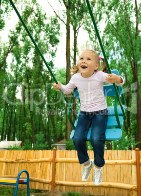 Cute little girl on swing