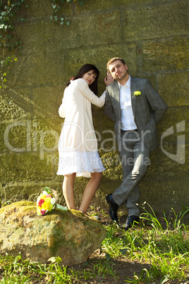 just  married   standing by the stone