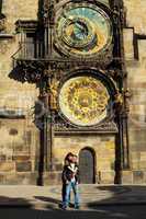 young couple in love at Prague's astronomical clock