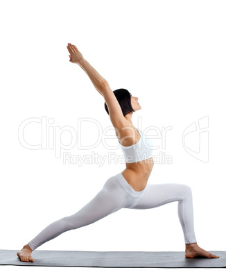 woman stand in yoga pose on rubber mat