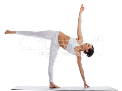 woman stand in yoga asana - half moon pose