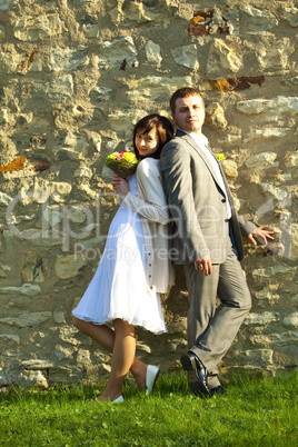 just  married   standing at wall
