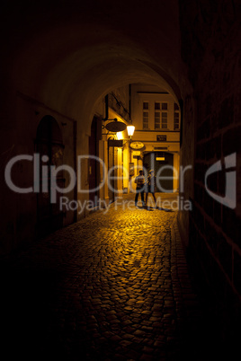 young couple in an arch on the street