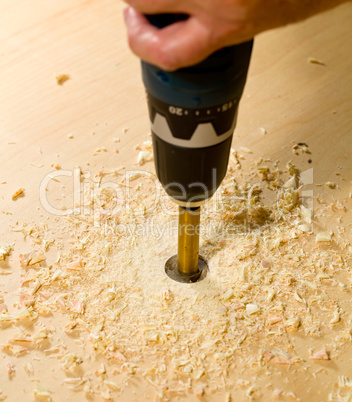 Woodwork tools working on piece of plywood