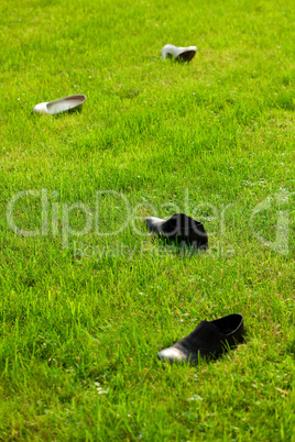 shoes bride and groom lying on green grass
