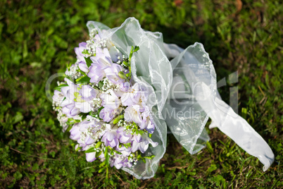 bridal bouquet lying on the grass