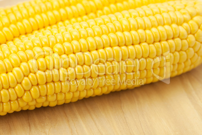 Corn lying on a cutting board