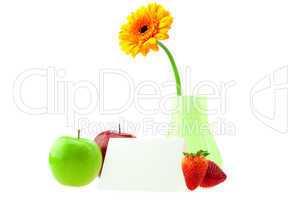 gerbera in a vase apples postcard and strawberries isolated on w