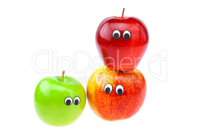 apples with eyes and faces isolated on white