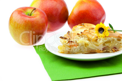 slice of apple pie apple and a flower isolated on white