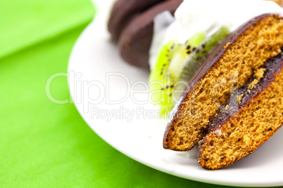 cake in the shape of heart and a flower lying on the green cloth