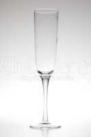 wine glass standing at  gray background