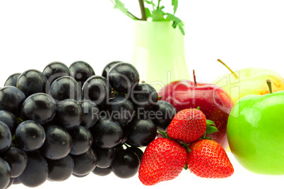 Grapes Strawberry Apple and vase isolated on white