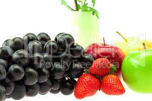 Grapes Strawberry Apple and vase isolated on white