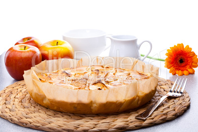 still life of apple pie, apple Gerbera milk jug and a cup