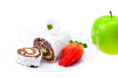 sweet rolls and strawberry on a saucer flower and apple isolated