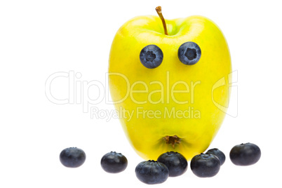 green apple with eyes and blackberries isolated on white