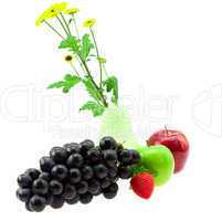 Grapes vase with flowers apples and strawberries isolated on whi