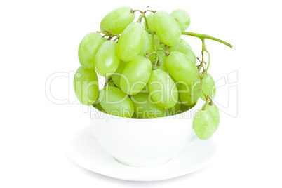 grapes   in the cup is isolated on white