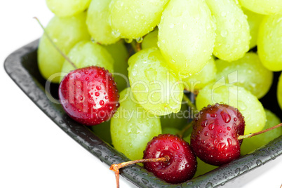 grapes cherry in the bowl is isolated on white