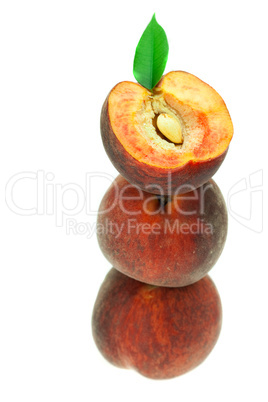 ripe peaches with green leaf isolated on white