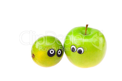 lime and apple with eyes and faces isolated on white