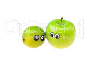 lime and apple with eyes and faces isolated on white