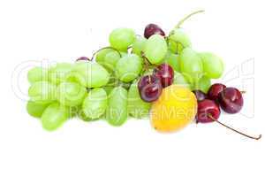 grapes, apricots and cherries isolated on white
