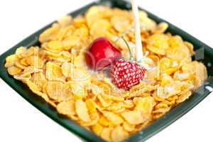 background of  bowl of cornflakes milk  cherry  and strawberry