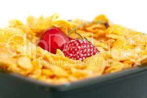 background of  bowl of cornflakes milk  cherry  and strawberry