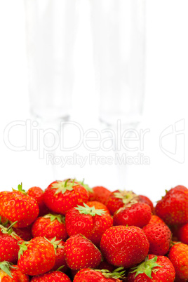 wine glass, a plate of strawberries isolated on white