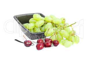 cup of grapes and cherries  isolated on white
