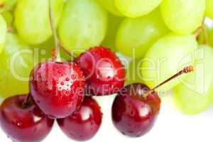grapes and cherries isolated on white