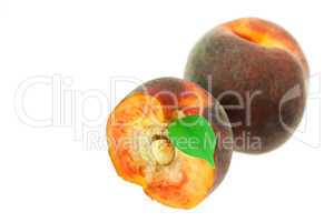 peaches with green leaf isolated on white