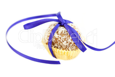 cake with coconut tied with ribbon isolated on white