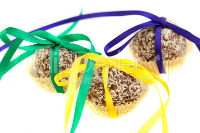 cake with coconut tied with ribbon isolated on white