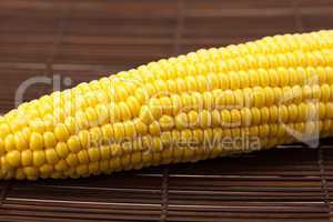 corn lying on a bamboo mat