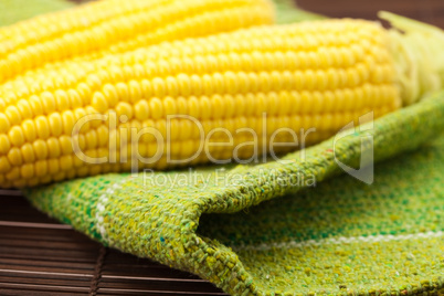 corn lying on a bamboo mat