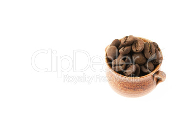 a small pot of coffee beans isolated on white