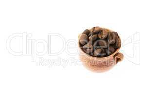a small pot of coffee beans isolated on white